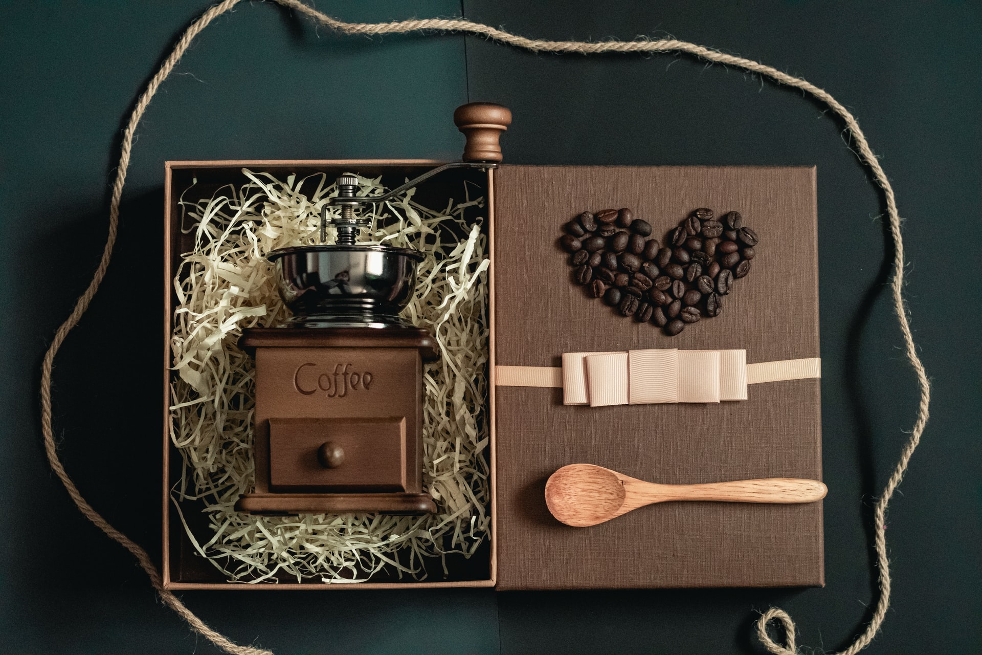 Opened gift box with coffee grinder.